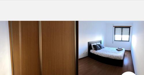 蒙蒂茹Wonderful apartament Lisbon的一间卧室配有一张床和一扇木门