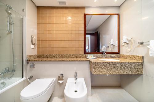 德拉星光大都市公寓酒店的一间浴室