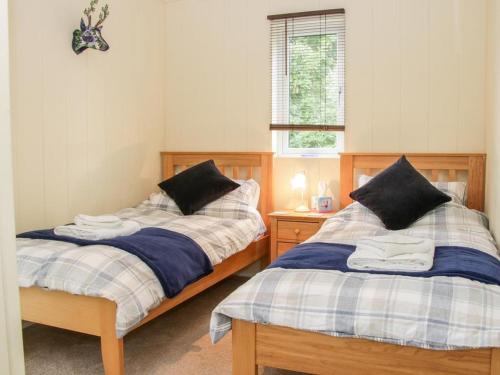 Alder River Lodge Clun Valley Luxury Hot Tub Break客房内的一张或多张床位