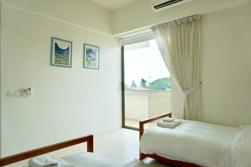 Beachfront Resort By The Sea, Batu Ferringhi客房内的一张或多张床位