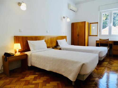 Poveira Hotel客房内的一张或多张床位