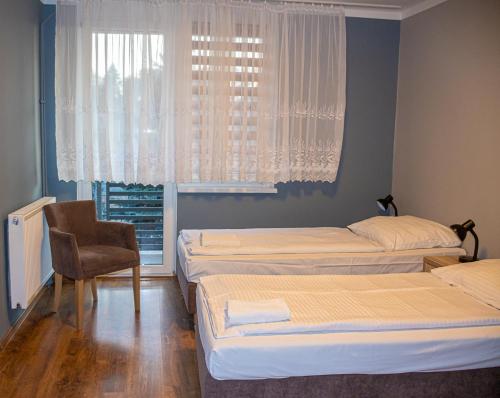 Olimpik Park客房内的一张或多张床位