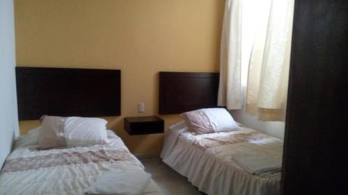 Hotel Posada San Juan客房内的一张或多张床位