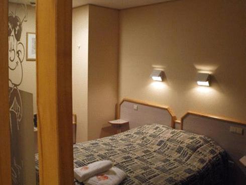 Familiehotel Soll Cress Koksijde客房内的一张或多张床位