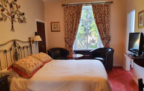 Stow Lodge Hotel客房内的一张或多张床位