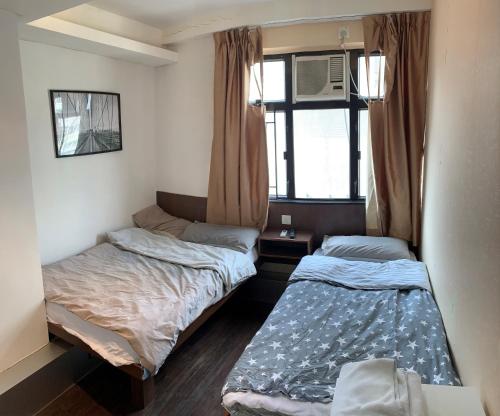 Oasis Apartments客房内的一张或多张床位