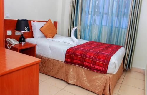 Sheratton Regency Hotel Nairobi客房内的一张或多张床位