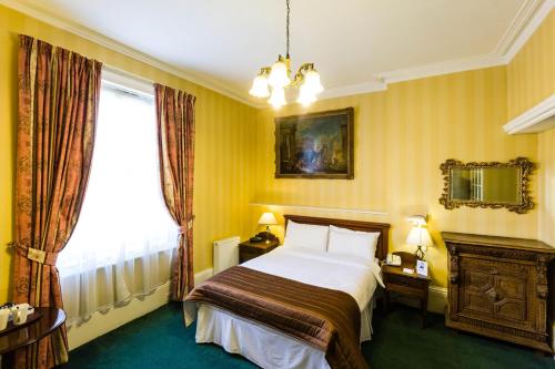 贝斯特韦斯特瑞士小屋酒店客房内的一张或多张床位