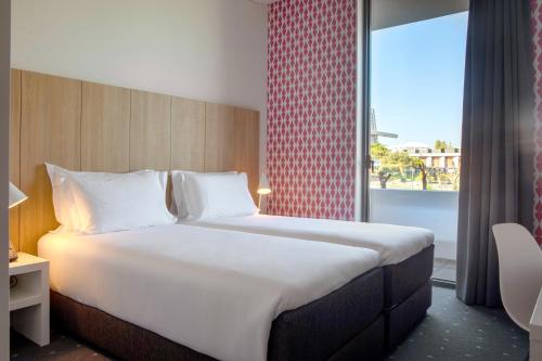 Stay Hotel Lisboa Aeroporto客房内的一张或多张床位