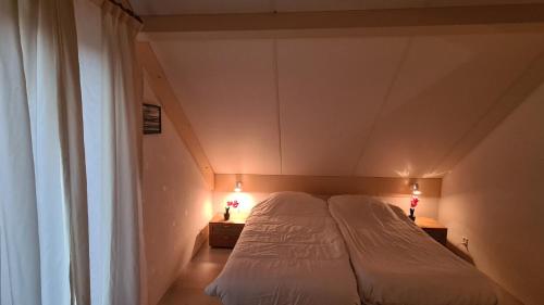 Vakantiewoning Maas en Waal客房内的一张或多张床位
