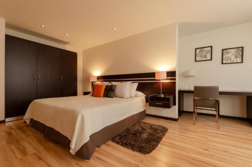Hotel NC La Paz客房内的一张或多张床位