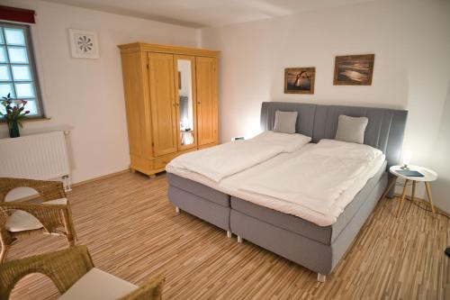 高登安克尔公寓式酒店客房内的一张或多张床位