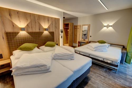 Der Siegeler B&B - this lifestylehotel rocks客房内的一张或多张床位