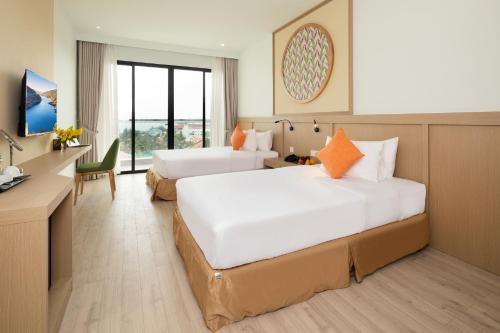 Hoan My Resort - Ninh Chu客房内的一张或多张床位