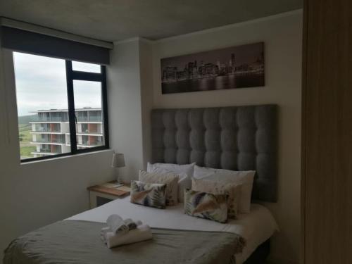 Coral Point Apartment - Sibaya, Umhlanga客房内的一张或多张床位