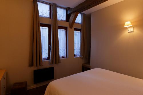 Appart'Hôtel Sainte Trinité客房内的一张或多张床位