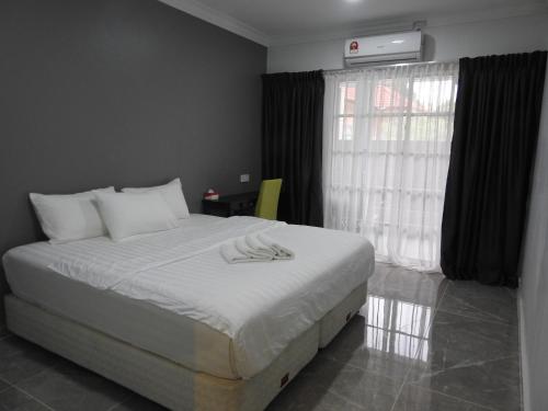 TEBiNG Guest House Taman Negara Malaysia Kuala Tahan客房内的一张或多张床位
