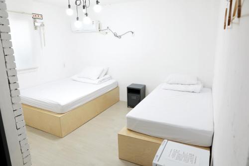 Minihotel Poongdaengi客房内的一张或多张床位