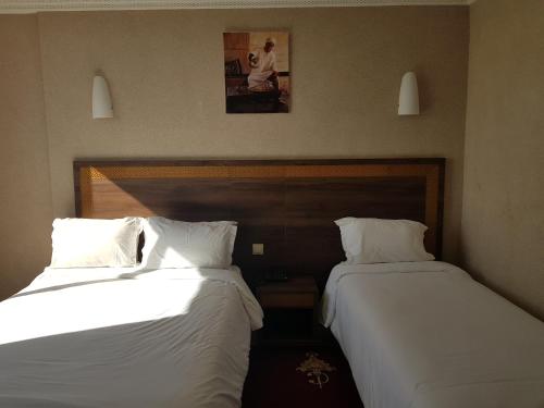 Hotel al Madina客房内的一张或多张床位