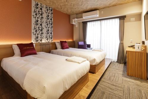 Five Hotel Osaka客房内的一张或多张床位