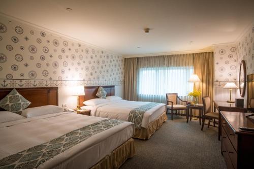 长荣桂冠酒店 - 基隆客房内的一张或多张床位