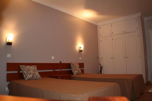 Vitor s Plaza Mariosilvat客房内的一张或多张床位