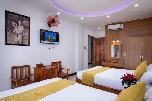Kim Hoàn Hotel Phan Rang客房内的一张或多张床位