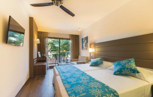 Hotel Riu Bravo - 0'0 All Inclusive客房内的一张或多张床位