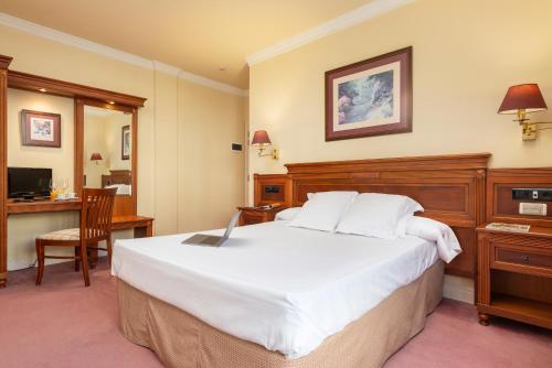 Hospedium Hotel Blu Loiu客房内的一张或多张床位