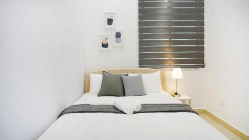 Desaru Exclusive Elegant theme by Joyfully 2M8客房内的一张或多张床位