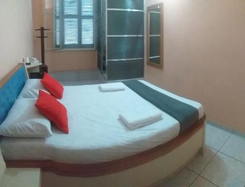 OYO Hotel Macedo客房内的一张或多张床位