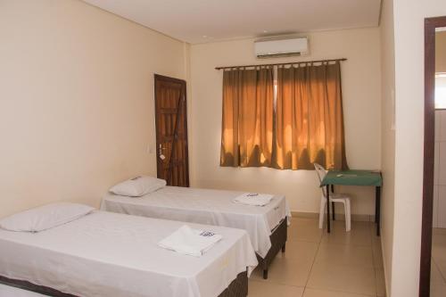 Hotel Novo Lar客房内的一张或多张床位