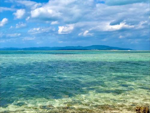 竹富岛Travelers House おーさんてぃん青空舎的享有海岸海景