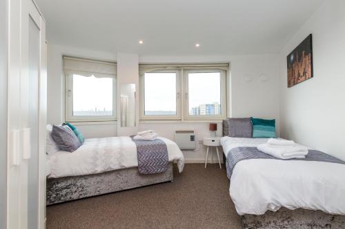 Newcastle City Centre Apartment Ideal for Holiday, Contractors, Quarantining客房内的一张或多张床位