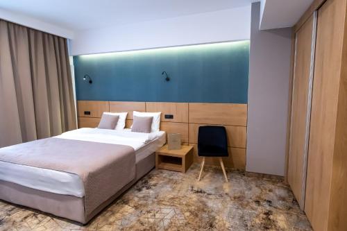 GRAND VIEW Hotel & Suites Copou客房内的一张或多张床位