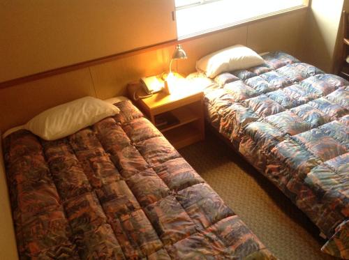 宫岛诚酒店客房内的一张或多张床位