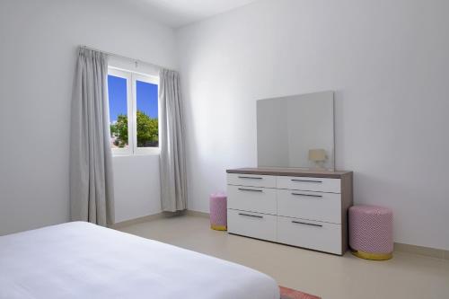 Le Sifah - Golf Lake Apartments客房内的一张或多张床位