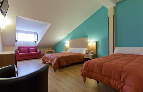 太阳门米拉多酒店客房内的一张或多张床位
