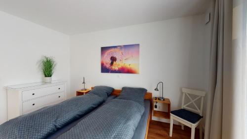 Seeblick Nordlicht, exklusive Wohnung mit Terrasse客房内的一张或多张床位