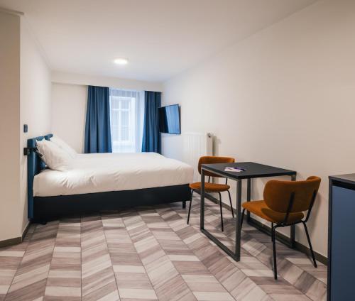 ROXI Residence Gent客房内的一张或多张床位