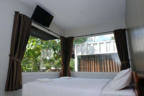 Hau Eco Lodges Citumang Pangandaran客房内的一张或多张床位