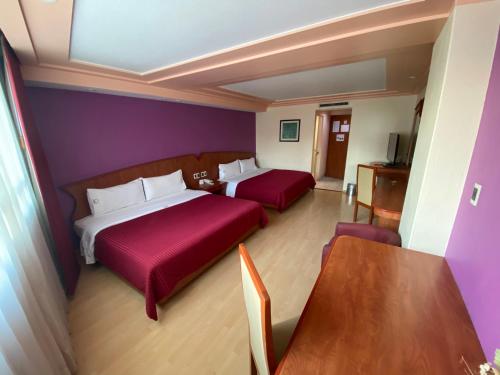 HOTEL MARIA RICO客房内的一张或多张床位