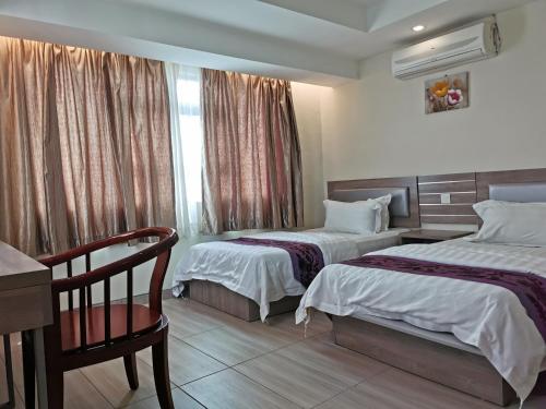 Melang Inn客房内的一张或多张床位