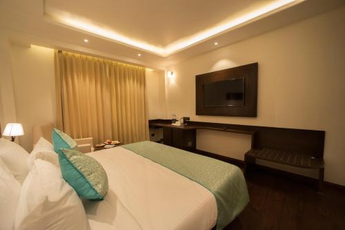 Hotel DVIJ INN客房内的一张或多张床位