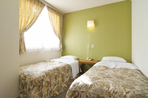 圣马尔特酒店客房内的一张或多张床位