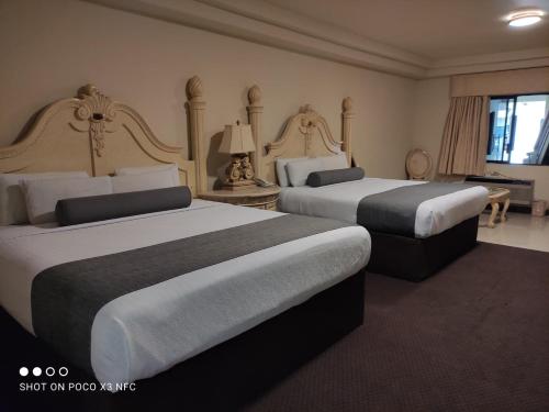 福伦迪勒蒂华纳酒店客房内的一张或多张床位
