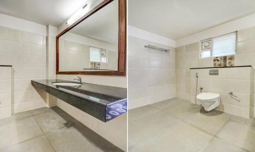 根尼亚古马里RR INN Group Of Hotels的一间带水槽和卫生间的浴室