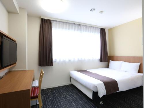 后乐园永安国际酒店客房内的一张或多张床位