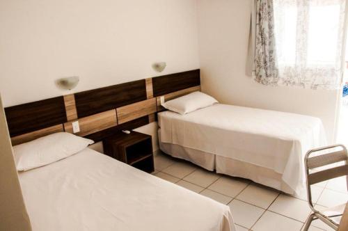 Hotel Ouro Negro客房内的一张或多张床位