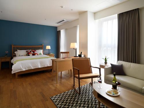 首尔拉卡萨酒店客房内的一张或多张床位
